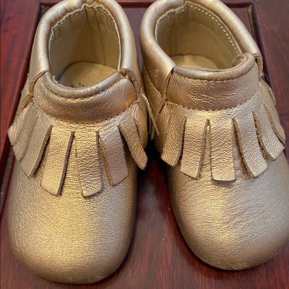 gold baby shoes